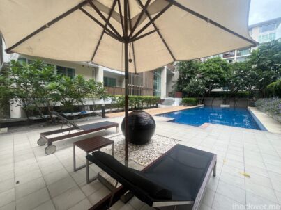 A sun bathing by the pool